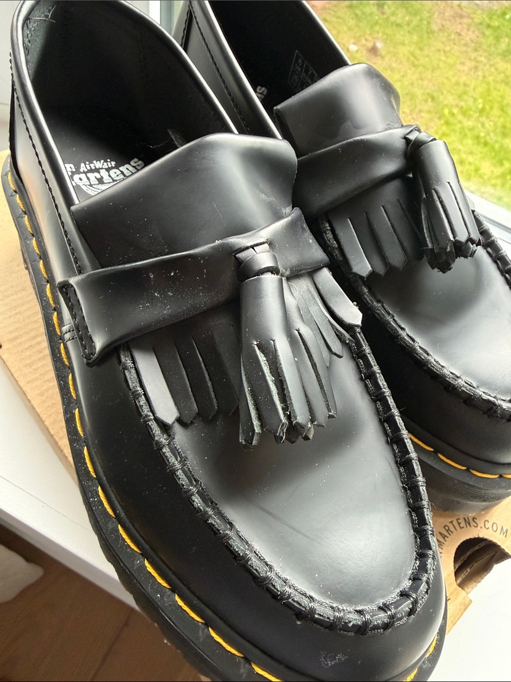 Dr. Martens Black Tassel Kiltie Loafers with Yellow Stitching